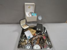 A tray of assorted costume jewellery to include wristwatches etc