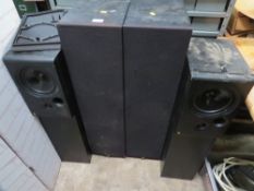 A pair of floor standing acoustic research speakers and a pair of KEF CODA floor standing speakers