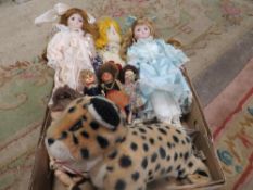 A tray of assorted dolls and soft toys