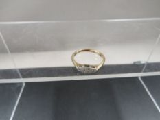 An antique 9ct gold and platinum three stone diamond ring, size O, weight approx. 1.8 g