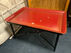 A modern metal red japanned tray top table H 52 W 98 cm Note - tray lifts off the frame