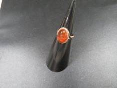 A hallmarked 9ct gold ring set with amber approx. weight 2g