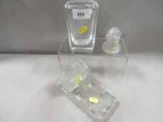 An Art Deco frosted glass combined toothpick holder and ashtray, with dog figure decoration,