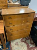 A vintage five drawer utility type chest of drawers