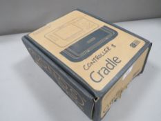 A boxed Sonos digital music system controller and cradle