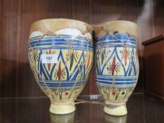A pair of ceramic bongo's