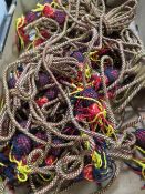 A tray of military bugle rope braid