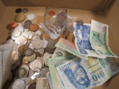 A box of assorted coins and notes