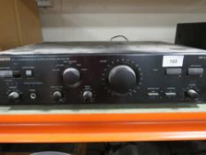 A Onkyo AV receiver TX-SR806 together with a wireless remote control amplifier R1 and a pair of