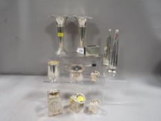 A small collection of stylized silver plated ware to include small graduated weights together with a