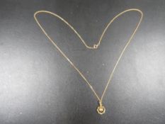 A hallmarked 9 carat gold pendant on chain approx. weight 1.3g