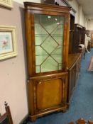 A reproduction mahogany glazed floor standing corner cabinet/cupboard
