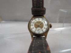 A vintage 'Aircraft' watch on a vintage leather strap with 'Rolex' logo