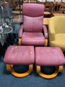 A modern upholstered Stressless style armchair and two foot stools