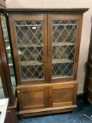 A vintage oak leaded bookcase W 98 cm