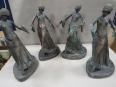 Four large cast metal figures A/F