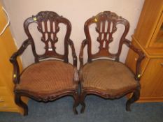 A pair of antique mahogany carved bergere seat armchairs A/F