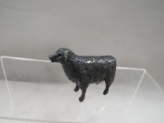 A small cold bronze cast figure of a sheep