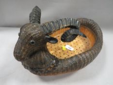 An unusual woven basket with rams head