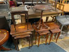 A modern mahogany nest of tables together with two occasional tables and another nest of tables