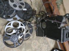 A vintage Specto film projector and reels of film
