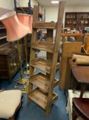 A modern five tier sloping open bookcase H 180 cm W 53 cm