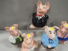 A set of five Wade NatWest piggy banks