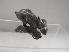 A small cold bronze cast figure of a running hare