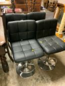 Four adjustable black barstools A/F