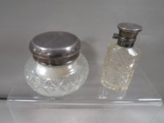 A silver mounted powder jar plus a Victorian scent bottle