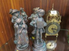A brass mantel clock together with six cast metal figures