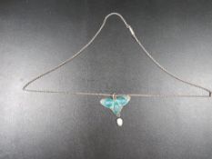 An antique Arts & Crafts pendant necklace hallmarked Birmingham 1909