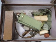 A small vintage case and contents to include military belts etc