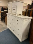 A large white modern multi drawer chest W 171 cm, together with a pair of bedside chests. (3)
