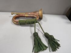A vintage copper and brass bugle
