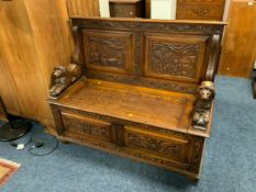 A heavy carved oak monks bench W 121 cm