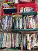 A large quantity of books over several trays to include many hardback war and railway related books