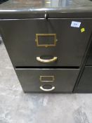 A vintage green 2 drawer filing cabinet