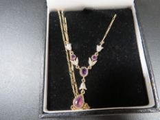 A hallmarked 9ct gold amethyst and small diamonds necklace