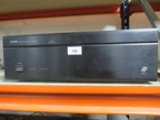 A Niles SI-1000200 systems integration amplifier (unchecked)