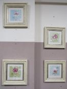 A set of four framed botanical prints in shabby chic frames