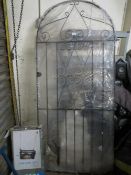 A wrapped garden gate together with a boxed Powerfix work stand and a retro Kodak point of sale