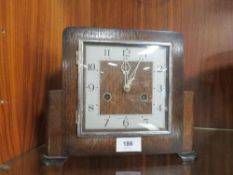 A Smiths Enfield Art Deco oak mantel clock