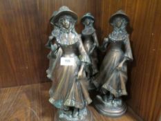 Four large cast metal figurines