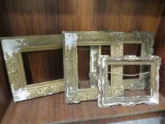 A tray of four antique gilt frames in need of restoration