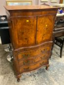 A walnut serpentine fronted drinks cabinet on chest H 125 cm W 68 cm