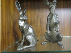 Two Frith sculpture bronze effect models of a hare
