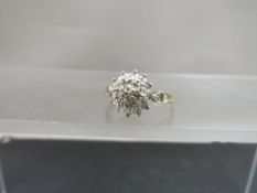 A hallmarked 9ct gold diamond cluster ring, size N, weight approx 2.1 g