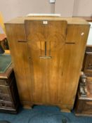 An art deco style walnut cabinet