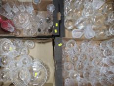 A large quantity of cut glass and crystal over several trays to include wine glasses, brandy glasses